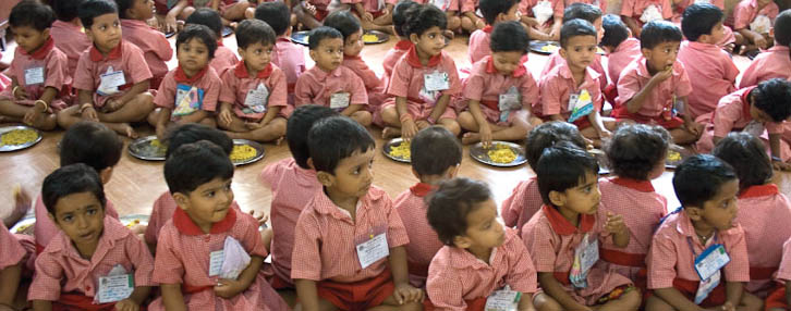 Happy children enjoying their free lunch