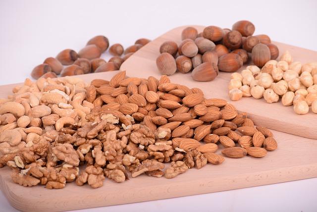 Walnut, almond, cashew, hazelnuts on the wooden cutting board
