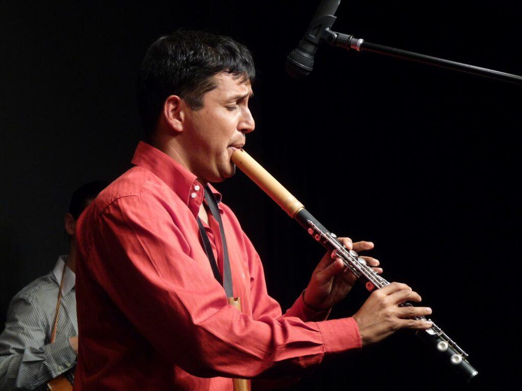 Dr. Luis De La Calle Playing the flute