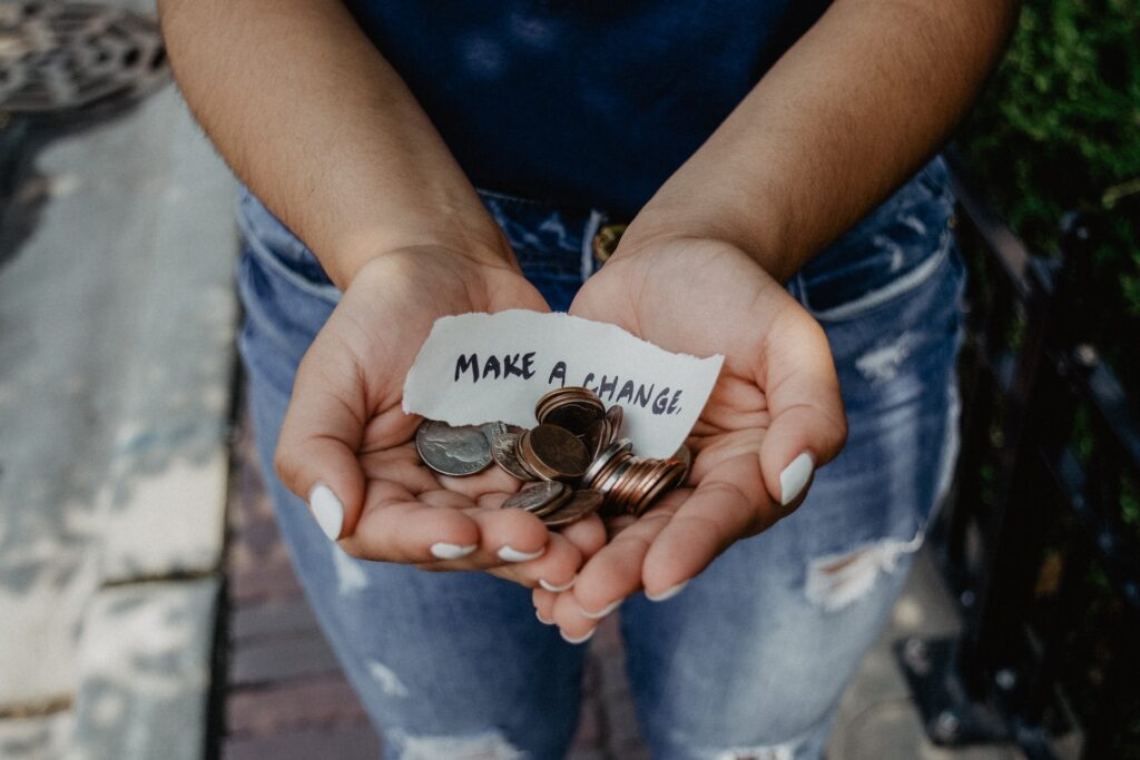 Women Holding coin for donation