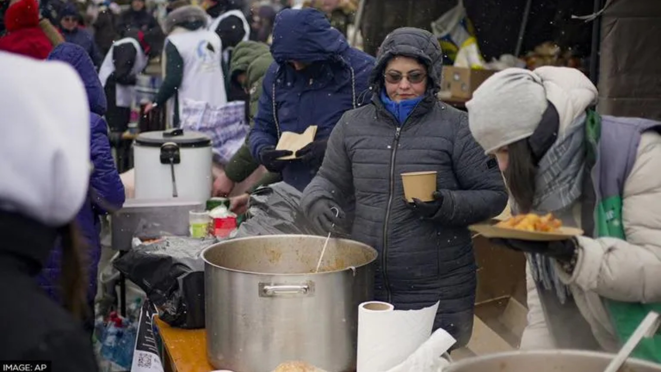 Women serving food on the area during winter