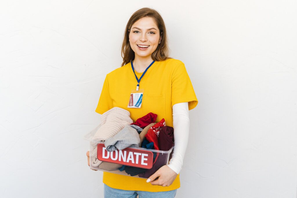 A woman donating clothes to a nonprofit